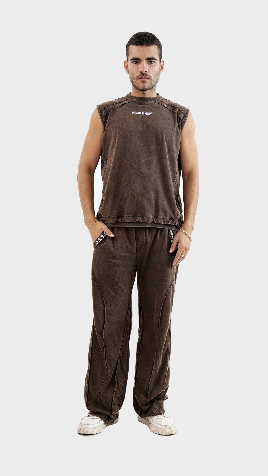 Full length front view of men's brown relaxed fit trouser.