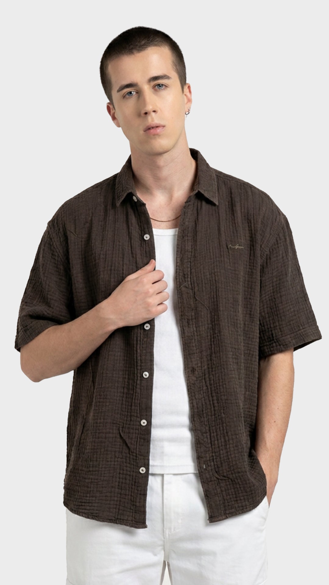 Direct back view showing the crinkle texture of a men's dark brown double cloth shirt.