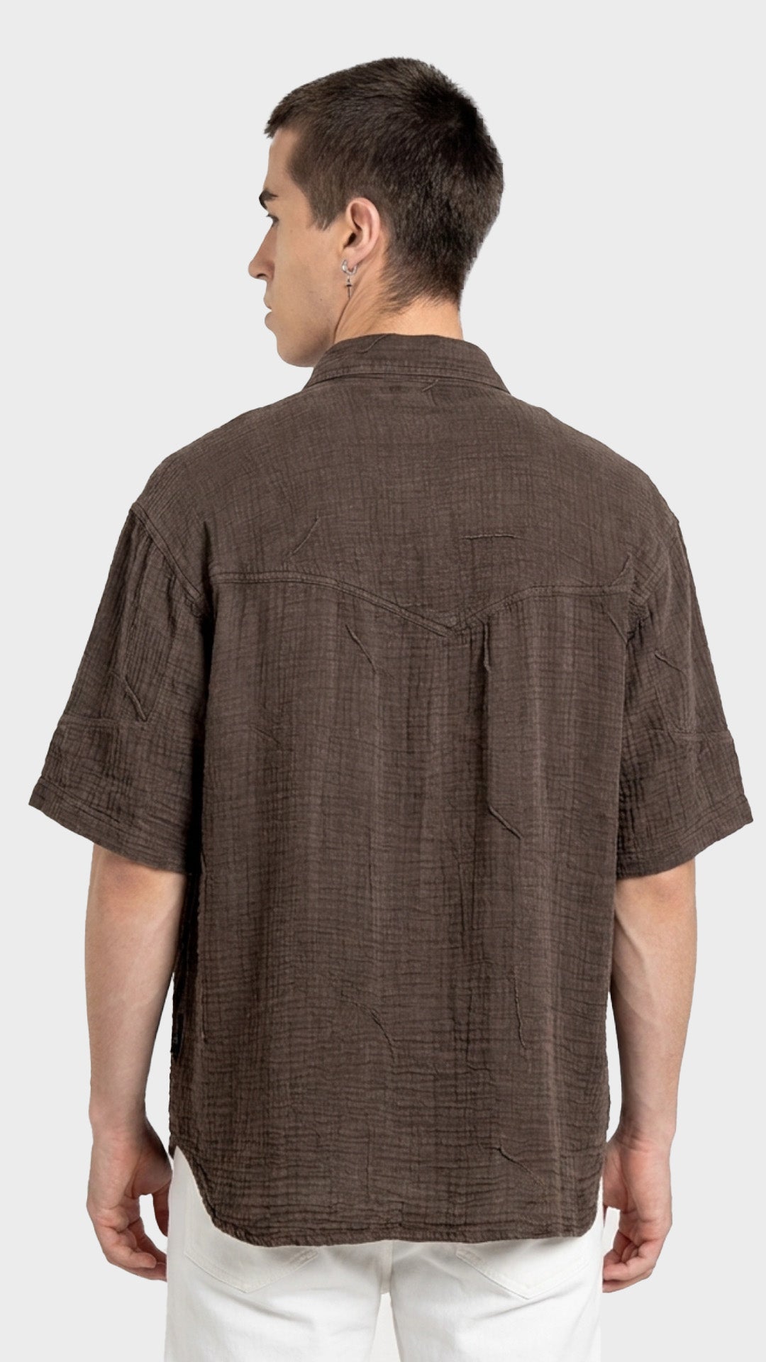 Front three-quarter view of a relaxed fit men's dark brown double cloth cotton shirt.