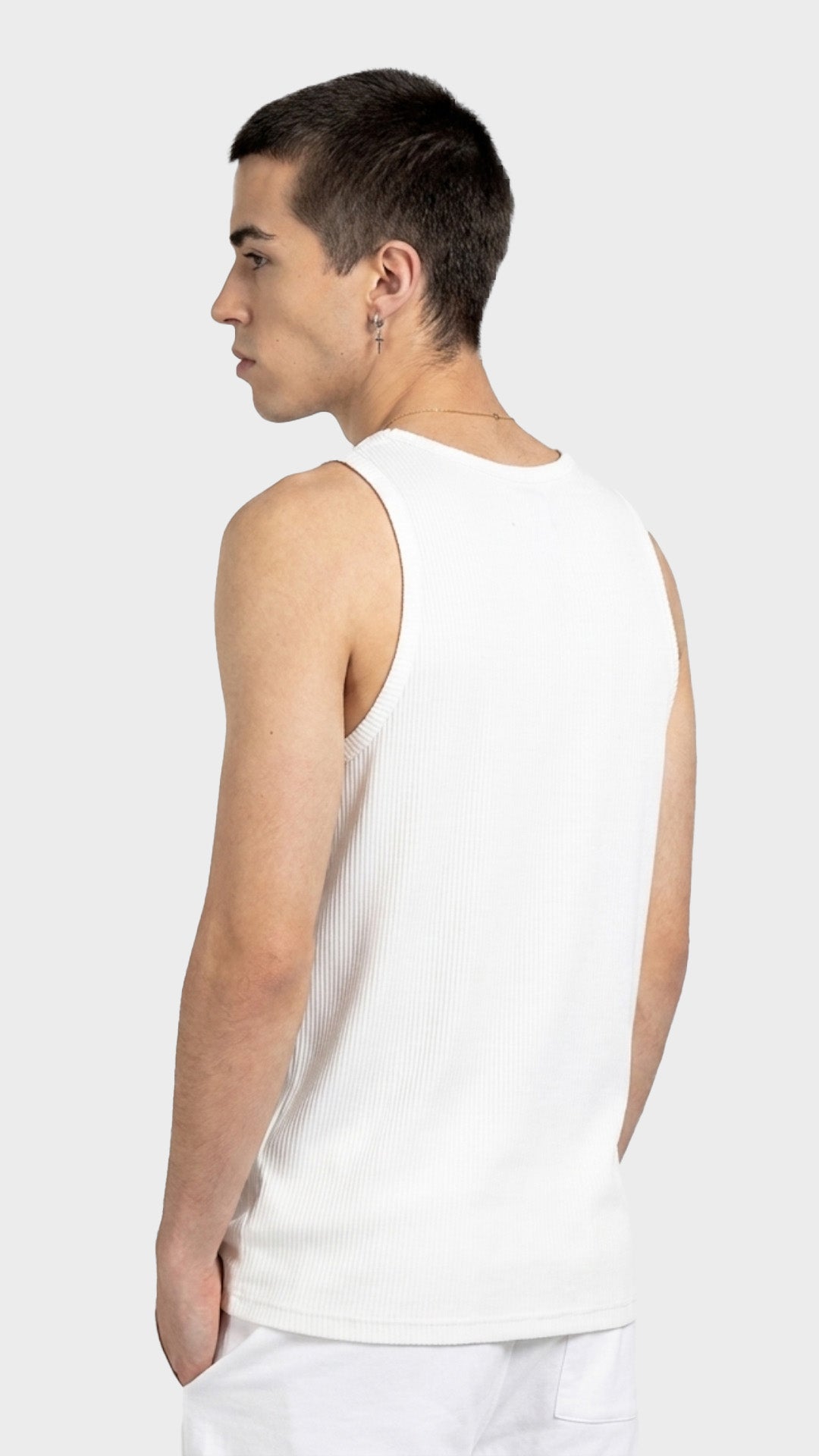 Back profile view of a fitted men's white ribbed vest.