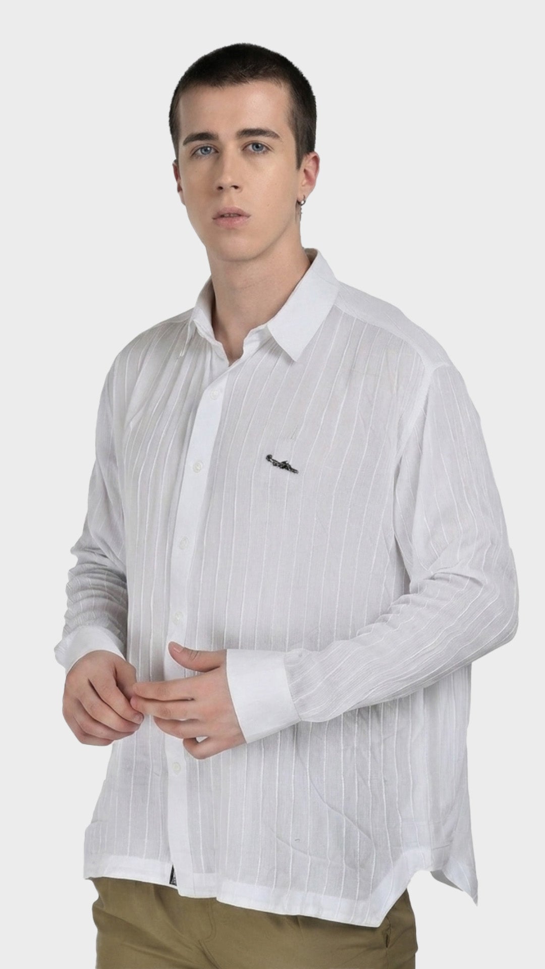 Three-quarter view of a men's white textured rayon crepe shirt with long sleeves.
