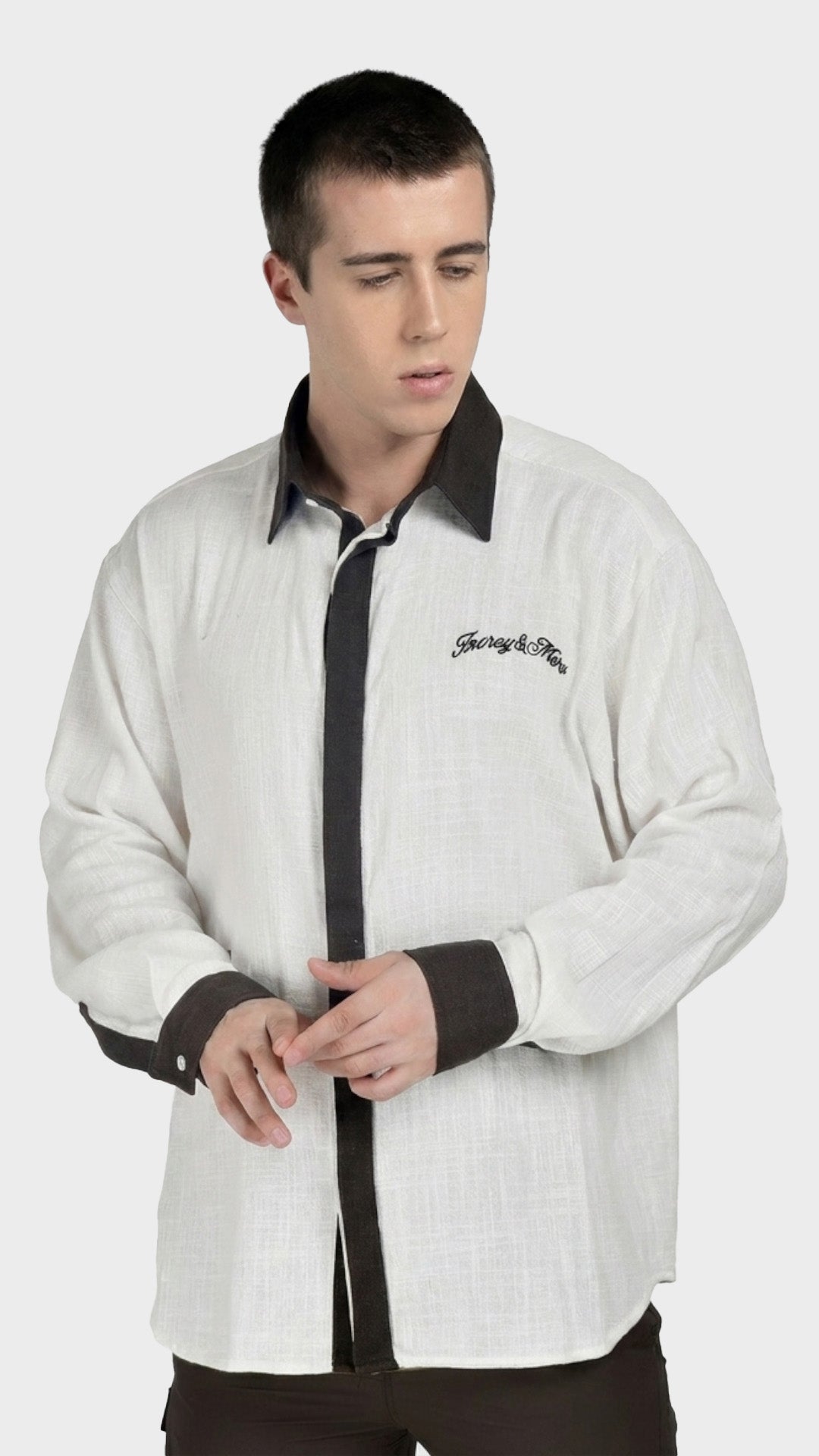 Front view of a men's white slub fabric shirt with dark brown contrast collar.