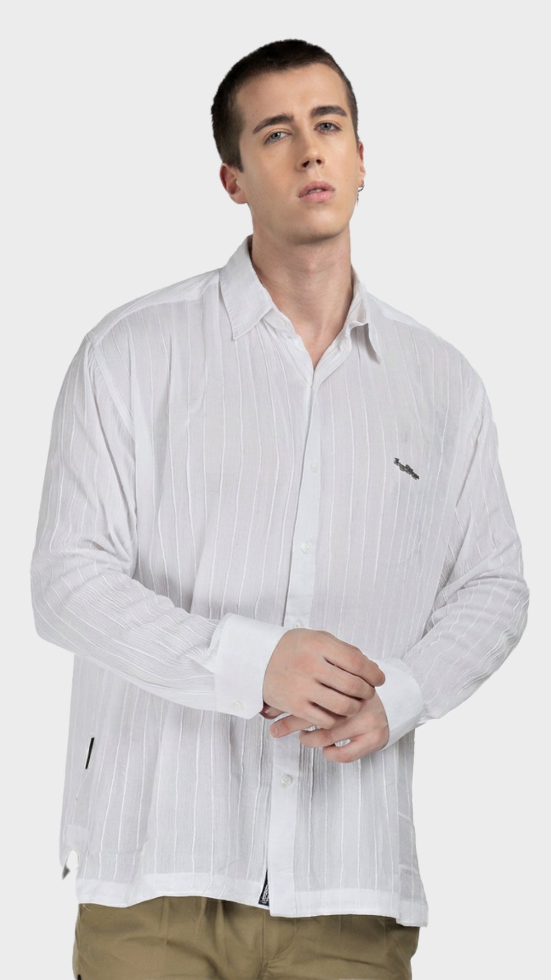 Front view of a male model wearing a white vertical stripe rayon crepe shirt.