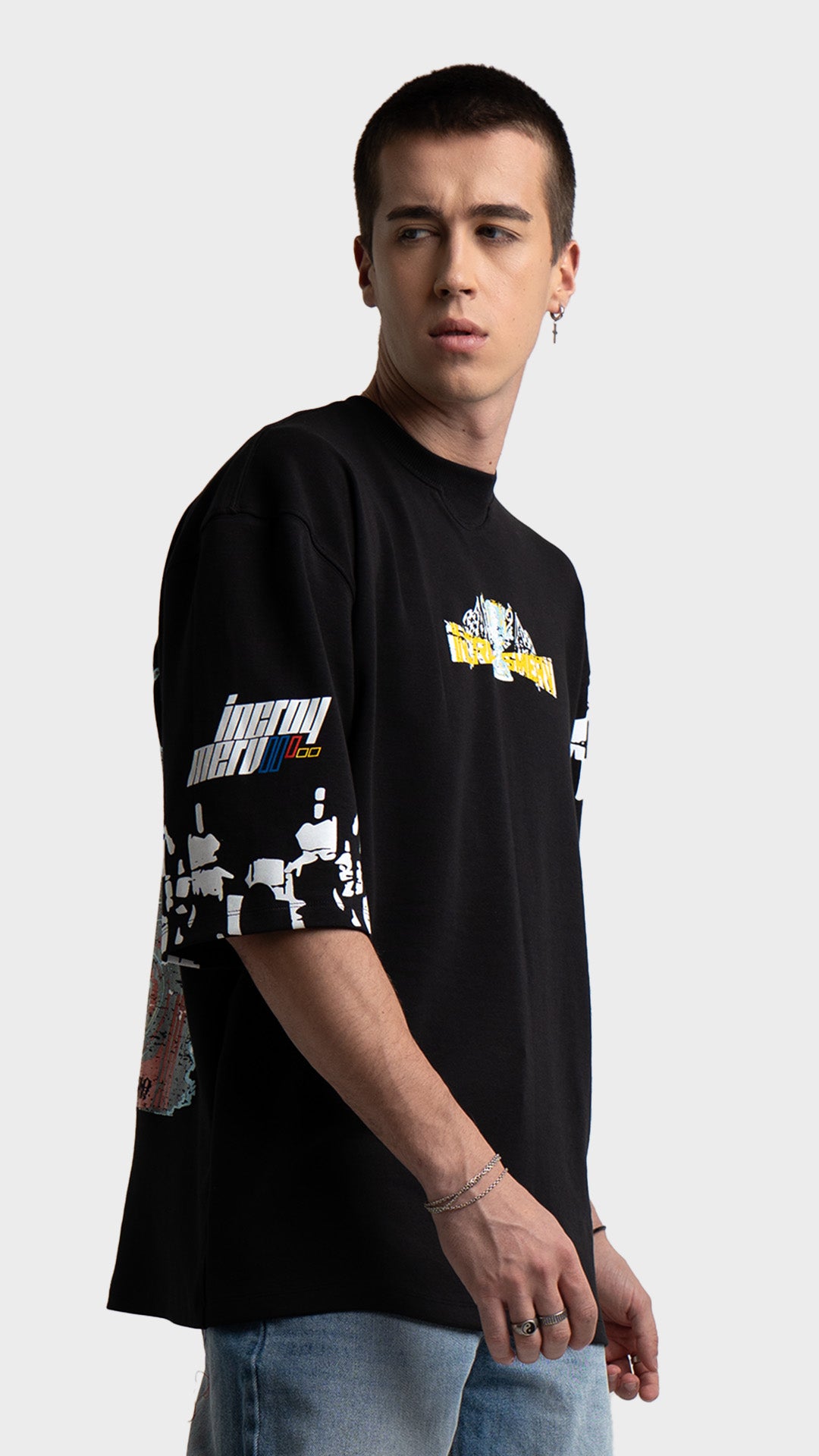 Oversized graphic t-shirt in black. Incroy & Merv relaxed fit lightweight summer tee styled with light wash blue jeans.