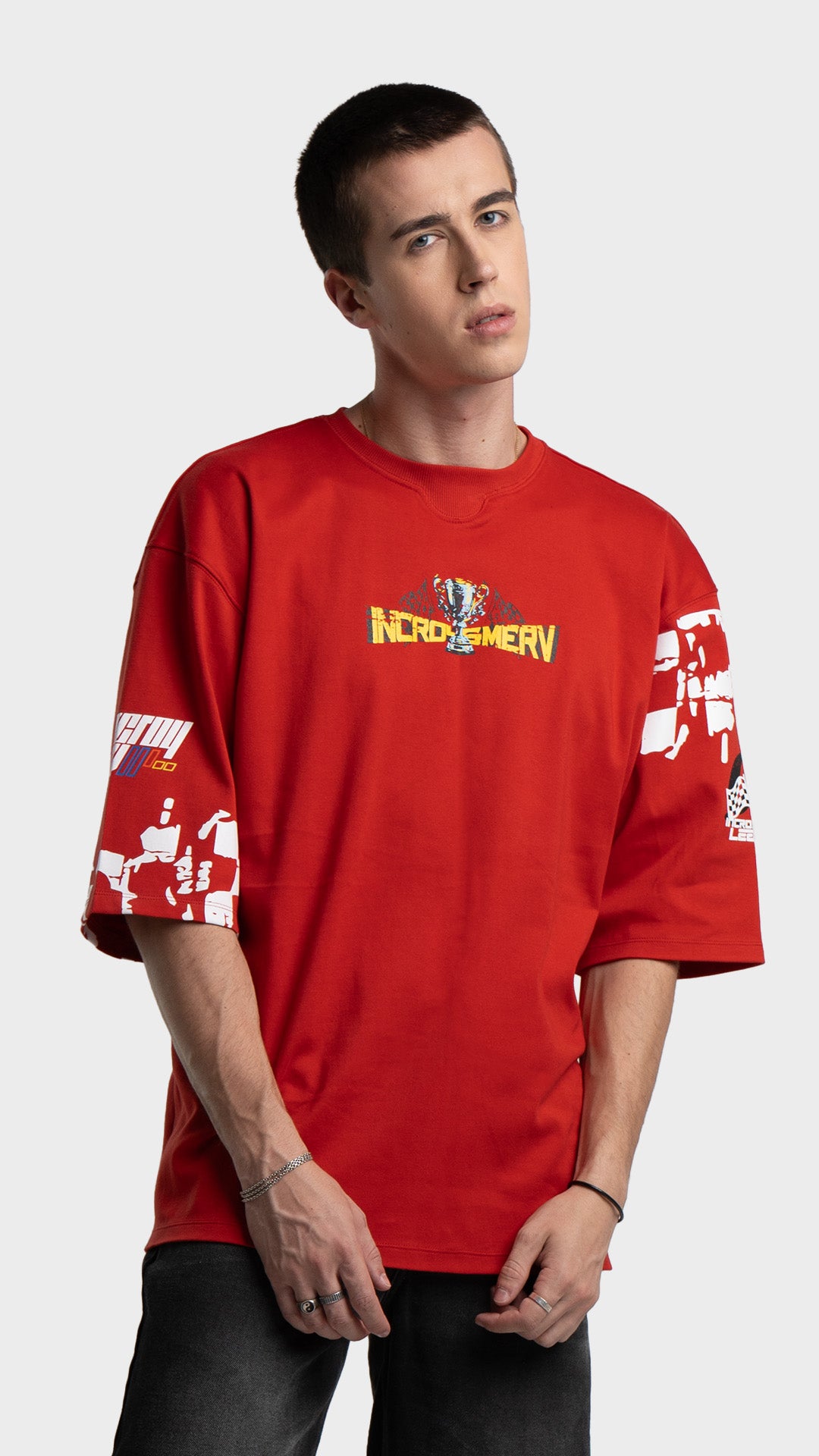 Mens red oversized graphic tee. Incroy & Merv premium streetwear t-shirt with custom chest logo detail.