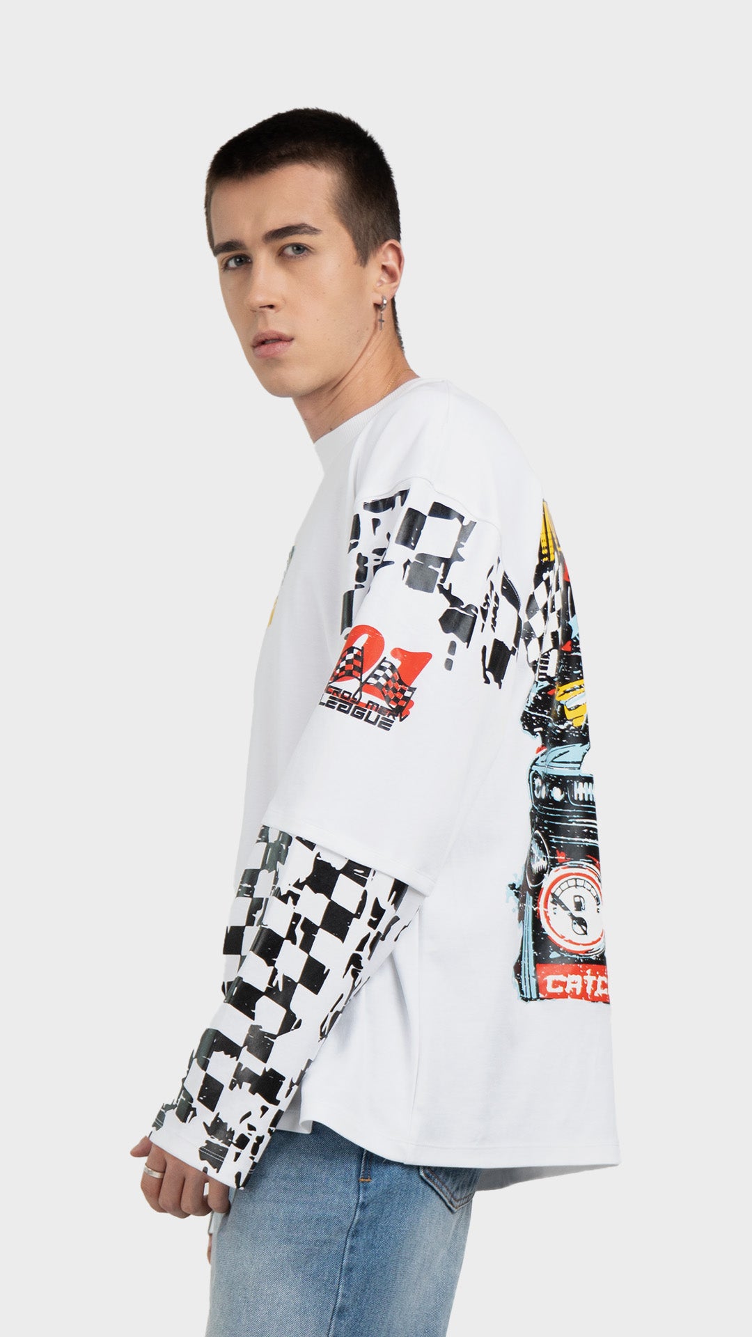 Mens white layered graphic tee side view. Incroy & Merv breathable, lightweight feel long sleeve streetwear shirt styled with light blue jeans.