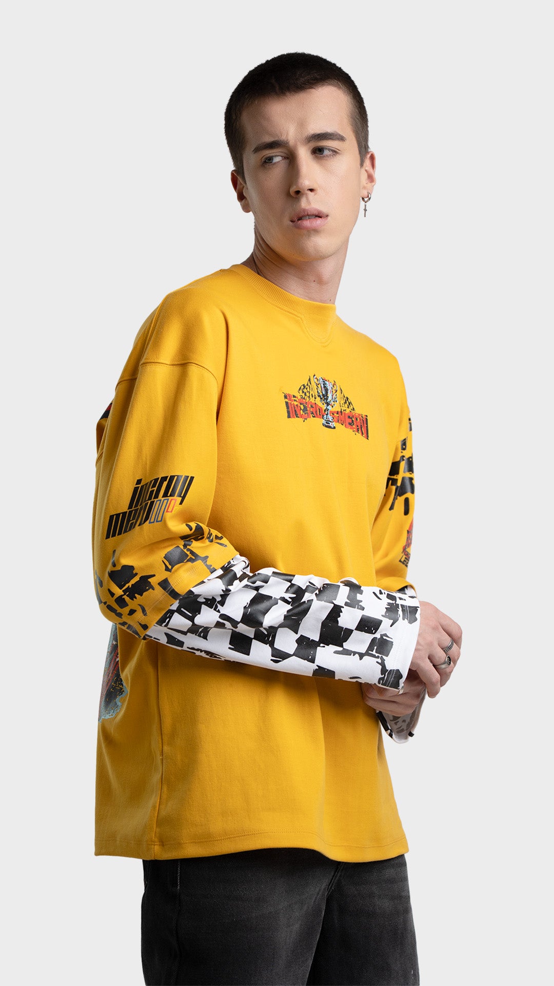 Mens yellow layered graphic tee side view. Incroy & Merv breathable, lightweight feel long sleeve streetwear shirt styled with dark jeans.