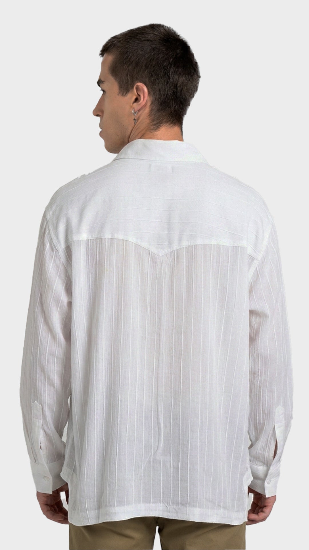 Back profile of a men's relaxed-fit white rayon crepe shirt showing yoke details.