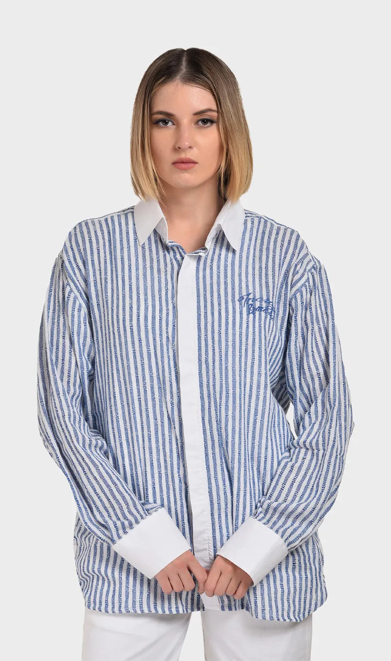 Front view of a women's blue and white striped long-sleeve shirt in textured dobby fabric with a contrasting white collar and cuffs.