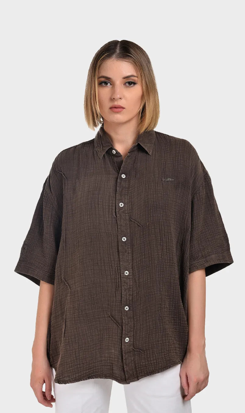Front view of a women's dark brown short-sleeve button-down shirt in textured 100% cotton double cloth fabric.