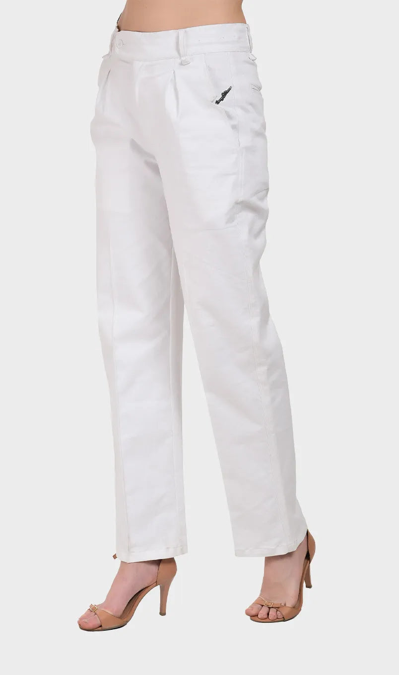 Three-quarter side view of a model in white high-waisted cotton Oxford pants with extended tab waistband.