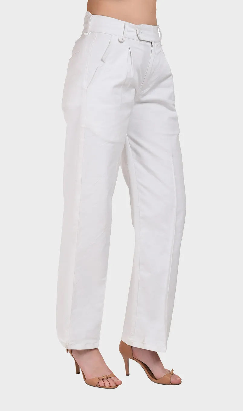 Side profile view showcasing the relaxed straight-leg silhouette of women's white cotton Oxford trousers styled with heels.