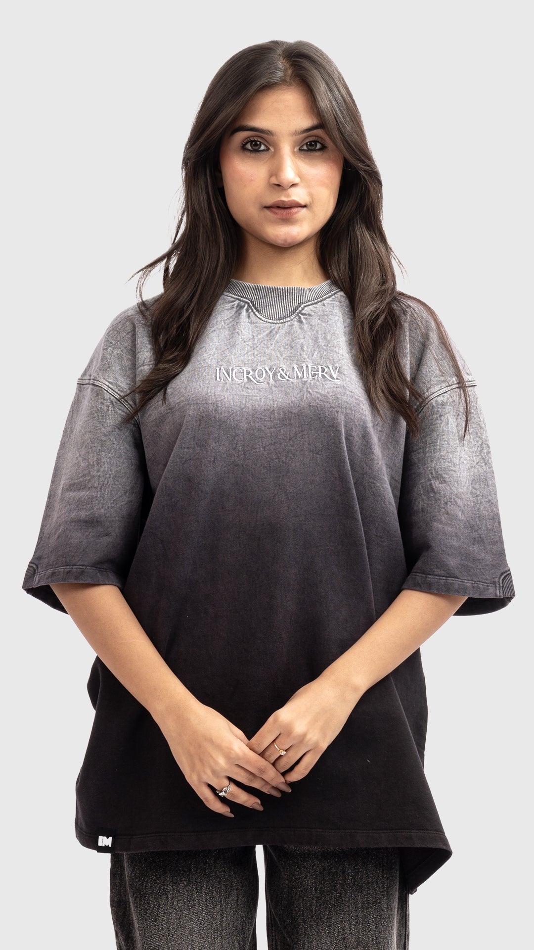 Front view of a women's acid wash grey to black ombre oversized t-shirt.
