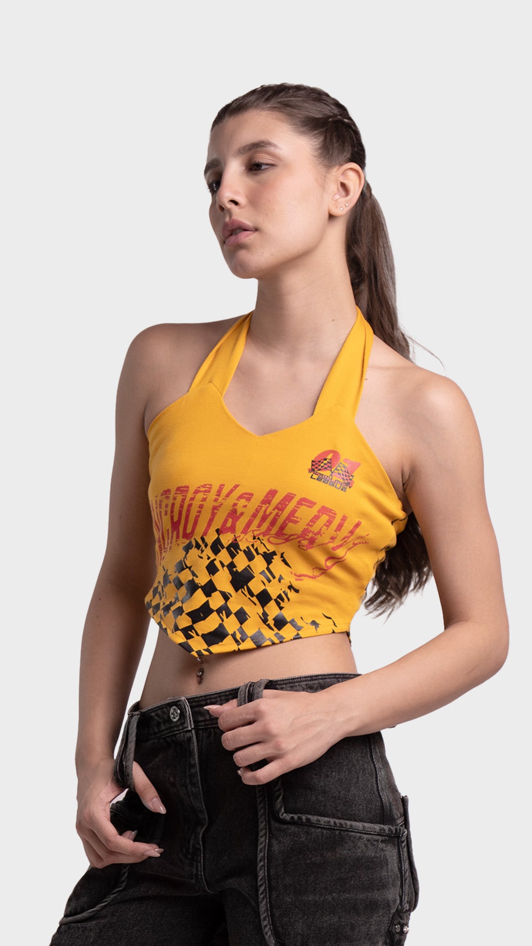 Women's yellow racing graphic halter crop top with checkered hem detail.