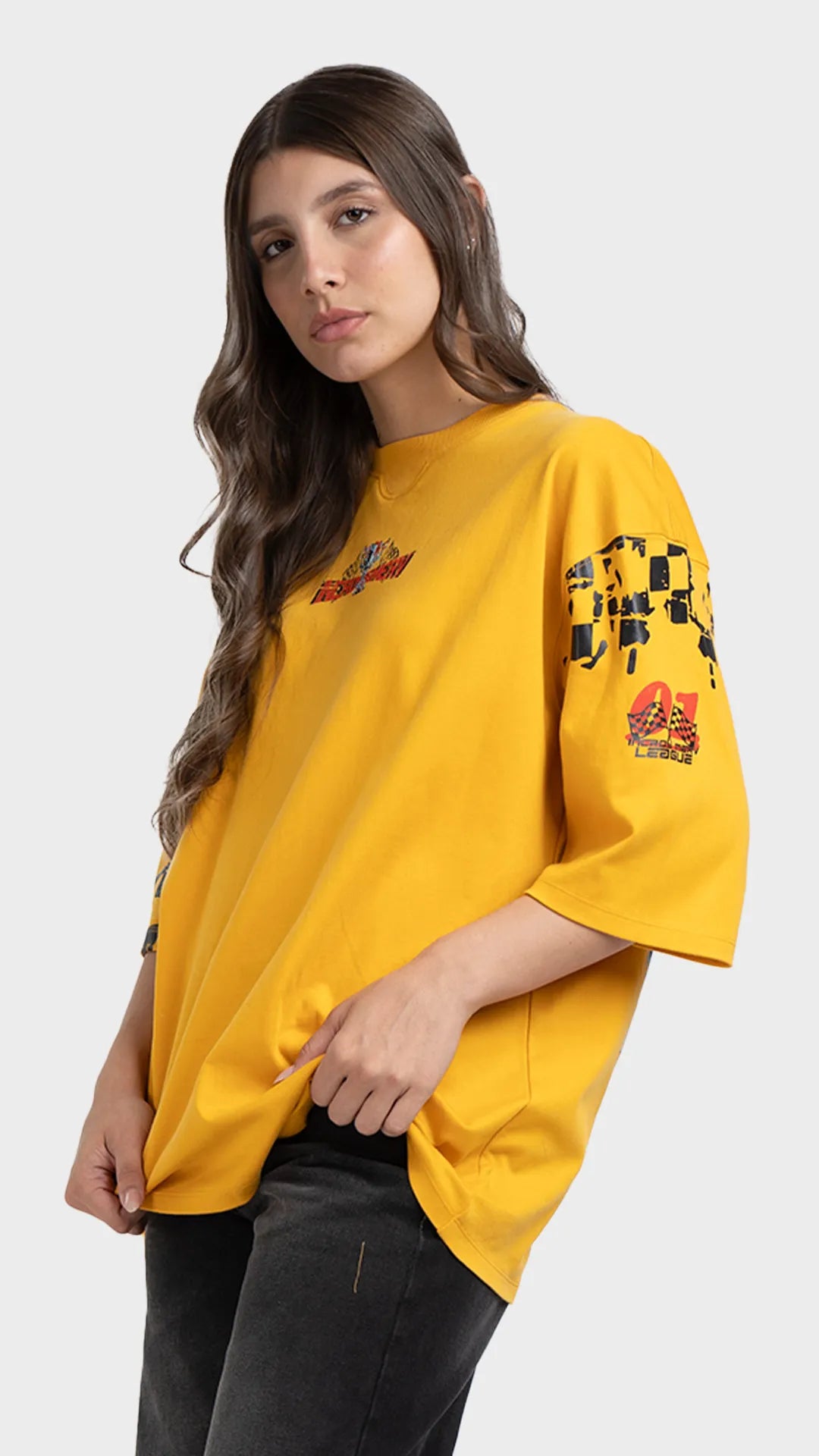 streetwear t-shirt. Loose fit drop-shoulder yellow racing graphic tee paired with black pants.